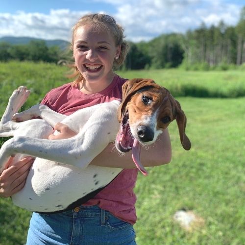girl holding dog